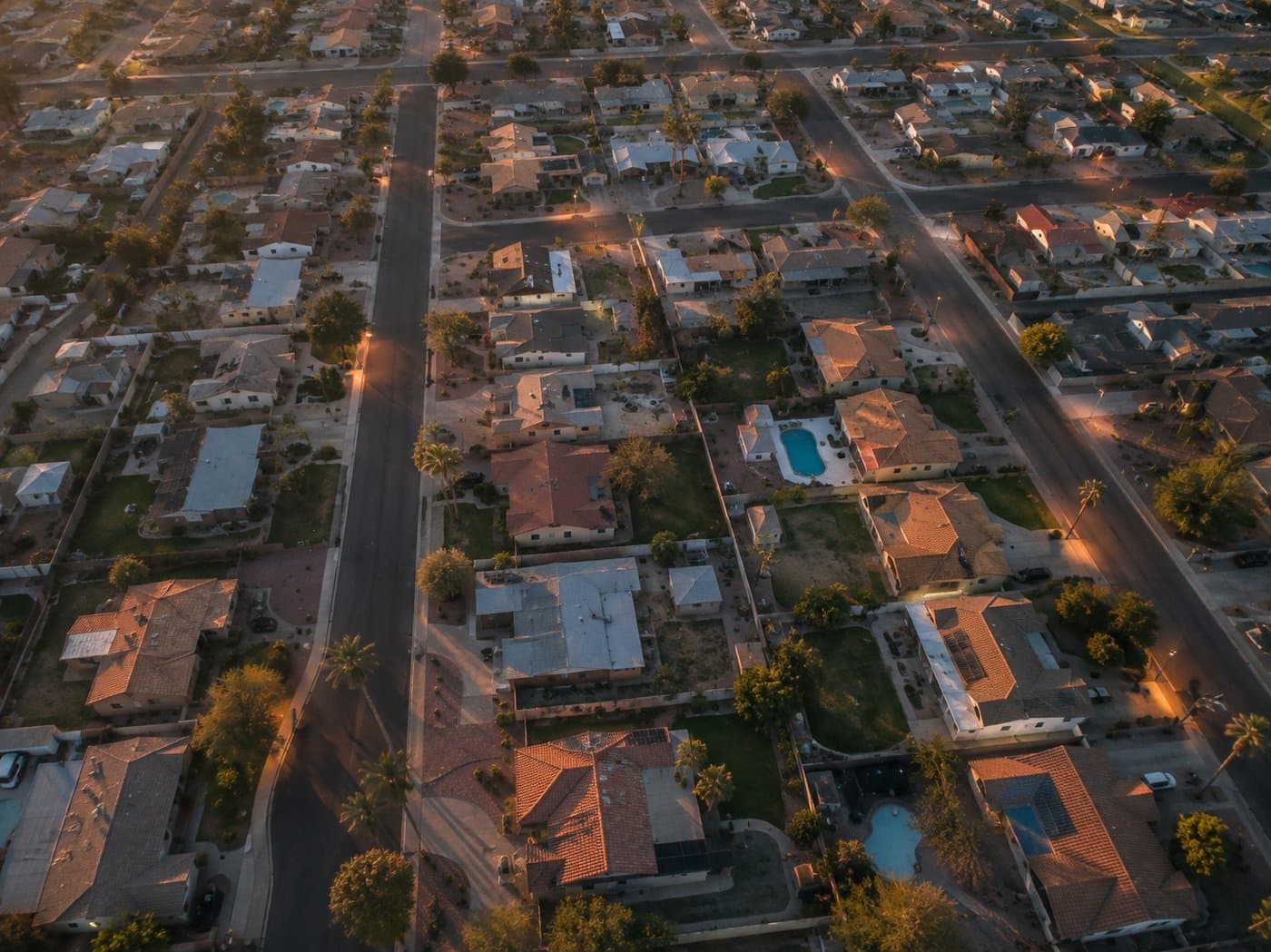 Aerial view of a Phoenix-area suburban neighborhood at dusk, representing the Moses Roadside service area
